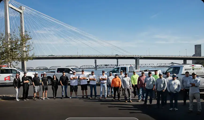 The A&A Roofing crew lined up with their trucks in front of the Pasco-Kennewick Cable Bridge